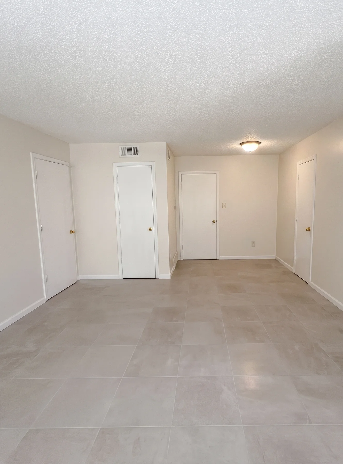 Spacious apartment interior with multiple closets