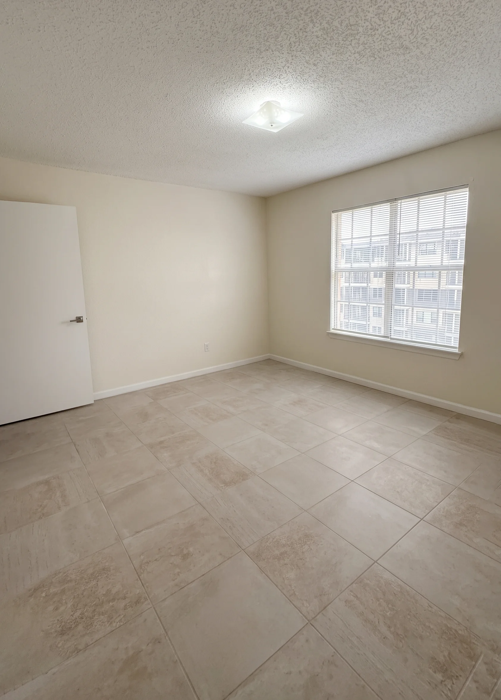 Bright apartment room with a large window