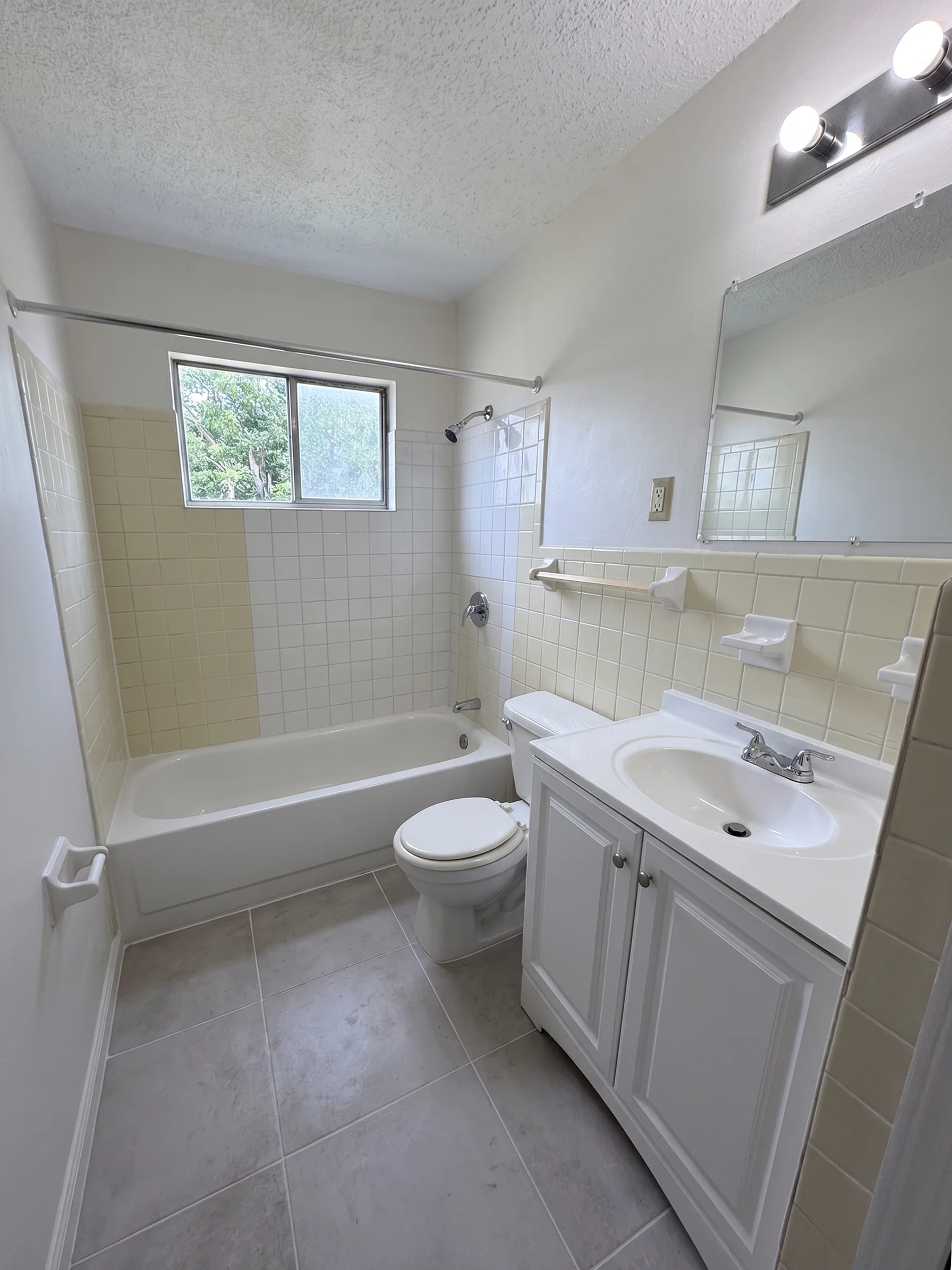 Valley Forge apartment bathroom with tiled bath